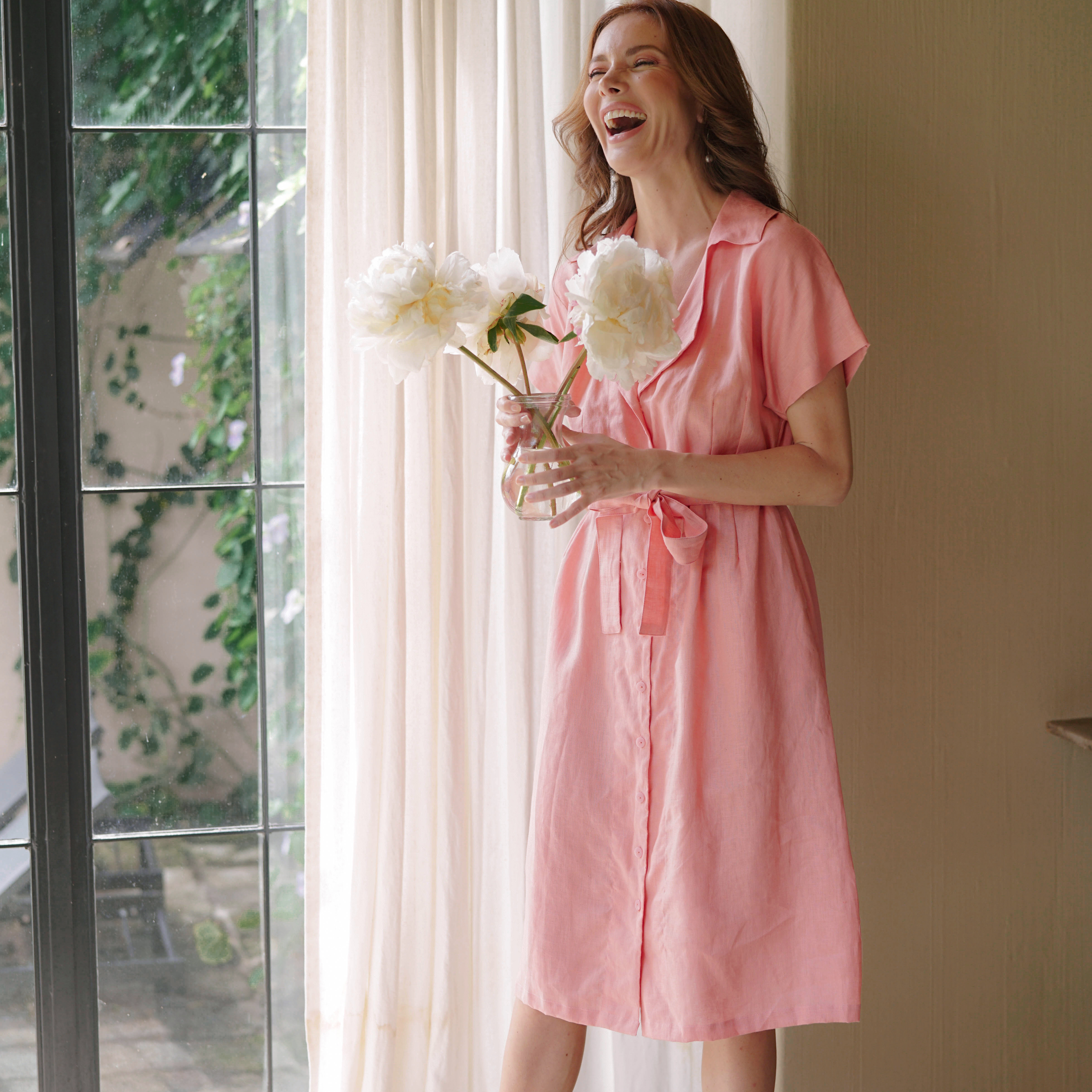 ARYA Safari Linen Midi Dress in Salmon Pink, featuring a button-down closure, linen belt, and spacious side pockets, handcrafted in Bali.