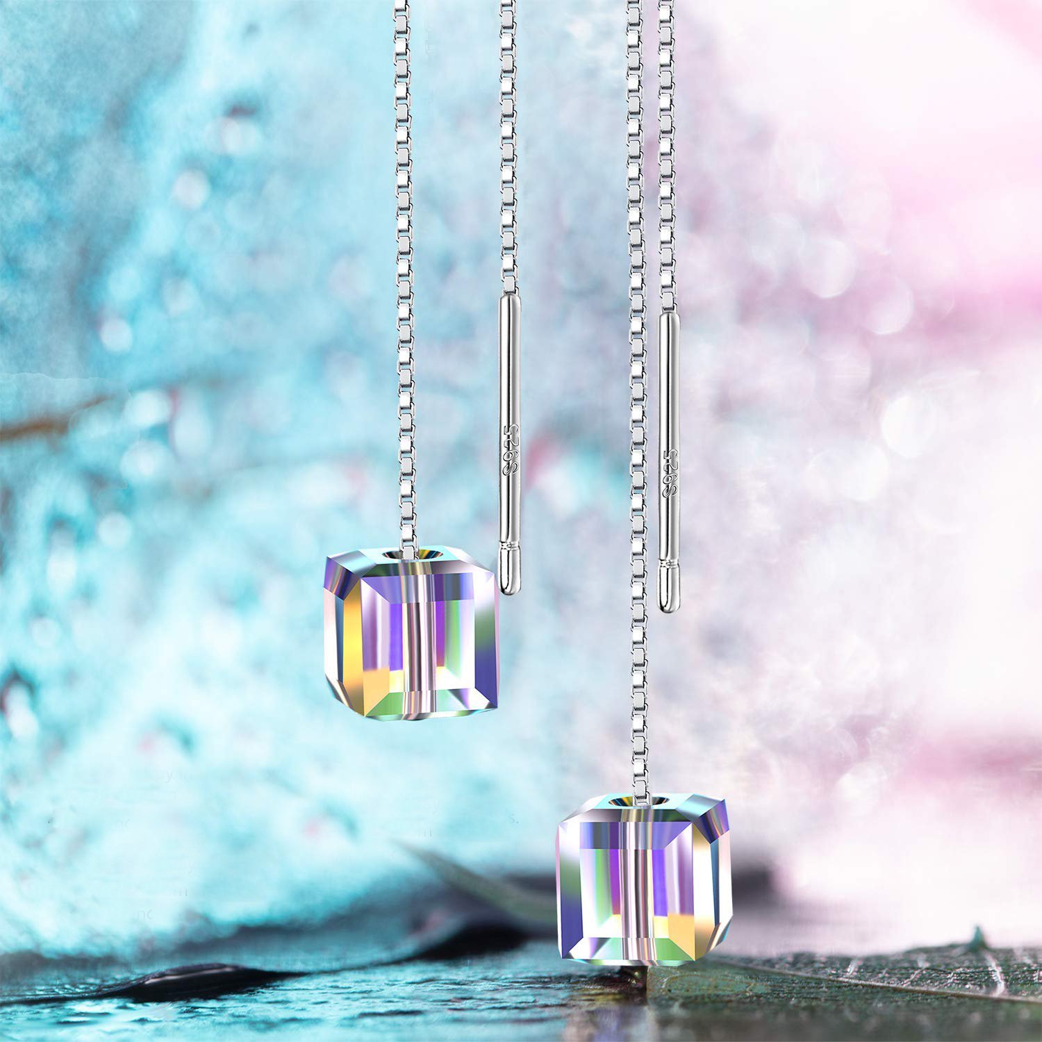 Aurora Borealis Swarovski Elements dangling earrings in 18K white gold, showcasing vibrant colors and elegant design.
