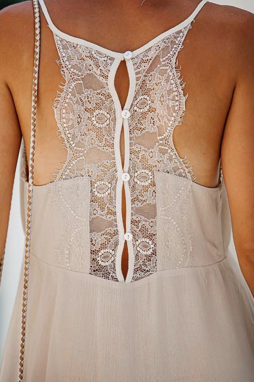 A stylish beige spaghetti straps lace babydoll dress featuring a hammock neckline and decorative lace and buttons, perfect for summer occasions.