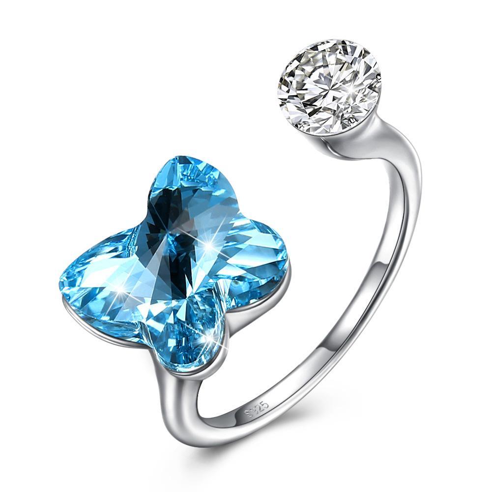 A stunning blue sapphire butterfly shaped adjustable ring made of solid sterling silver, showcasing intricate design and genuine gemstone.