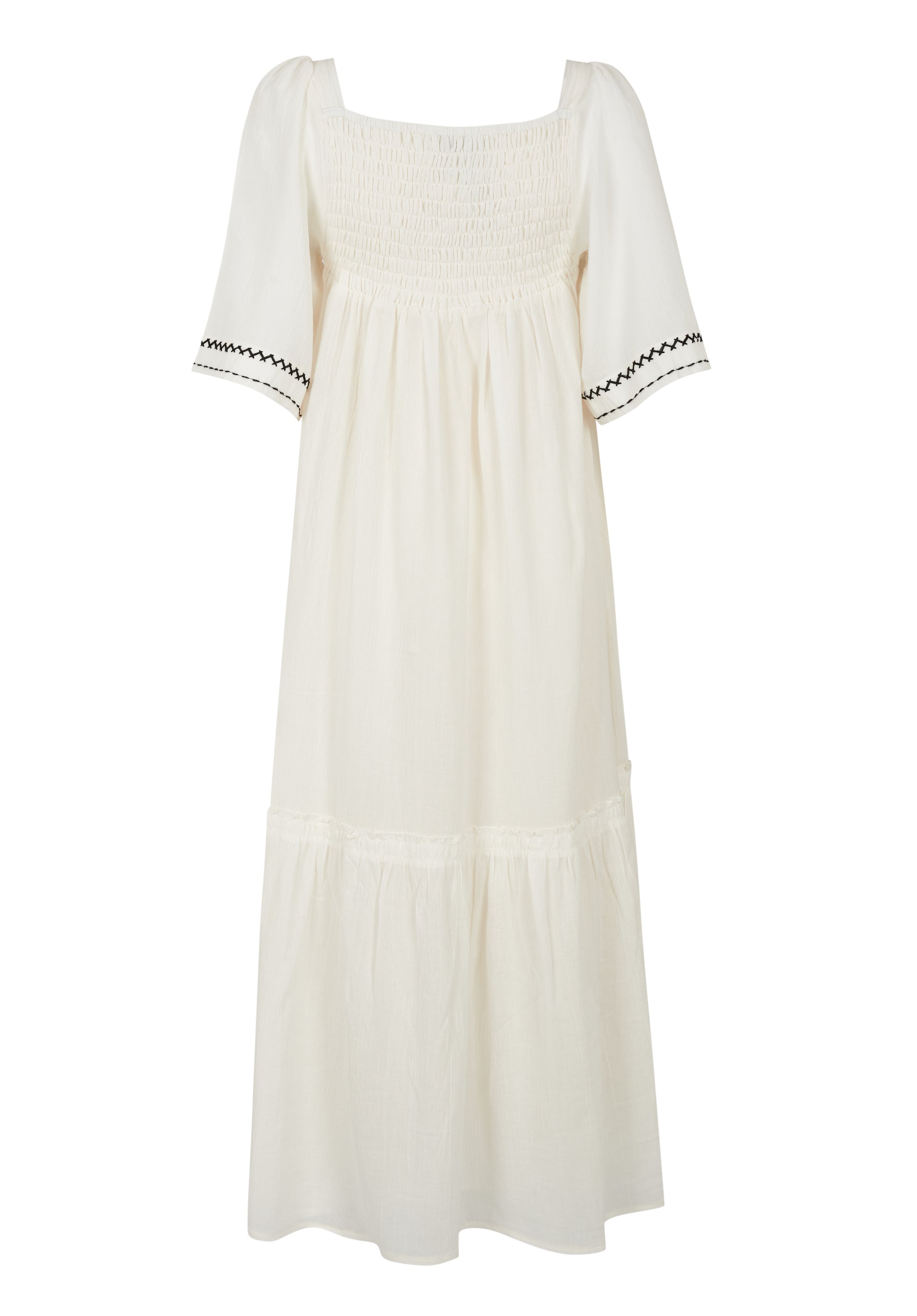 CASSIE MAXI DRESS in Natural featuring geometric embroidery and flexible shirring, perfect for outdoor events.