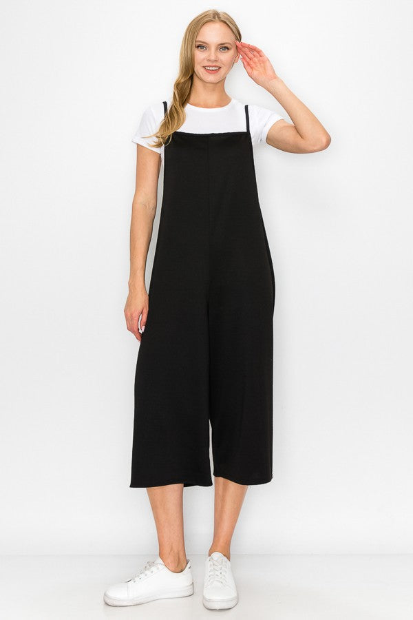 A stylish black cropped bottom wide leg oversized jumpsuit featuring spaghetti straps and a comfortable fit, perfect for casual and semi-formal occasions.