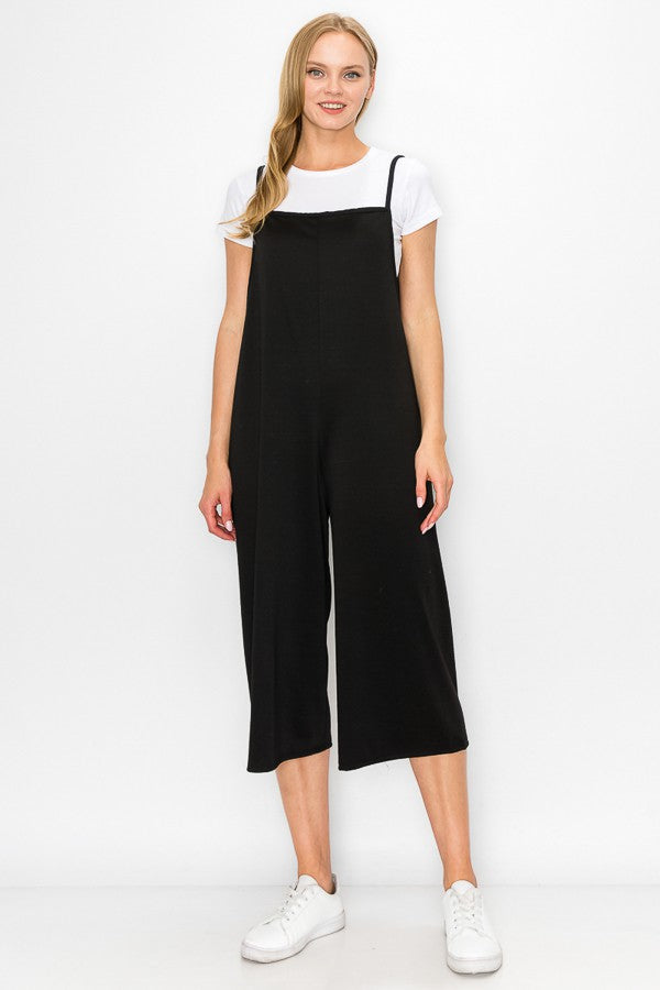 A stylish black cropped bottom wide leg oversized jumpsuit featuring spaghetti straps and a comfortable fit, perfect for casual and semi-formal occasions.