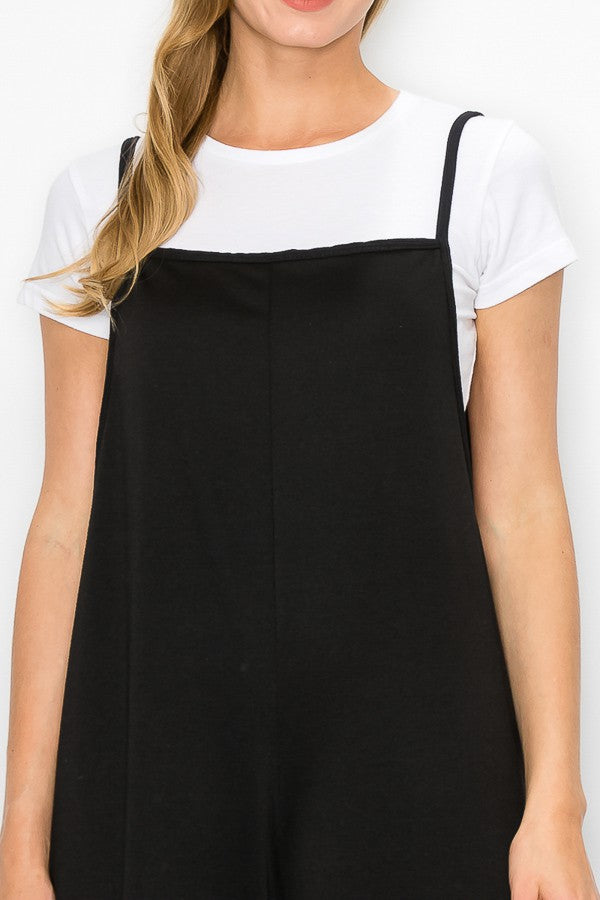 A stylish black cropped bottom wide leg oversized jumpsuit featuring spaghetti straps and a comfortable fit, perfect for casual and semi-formal occasions.