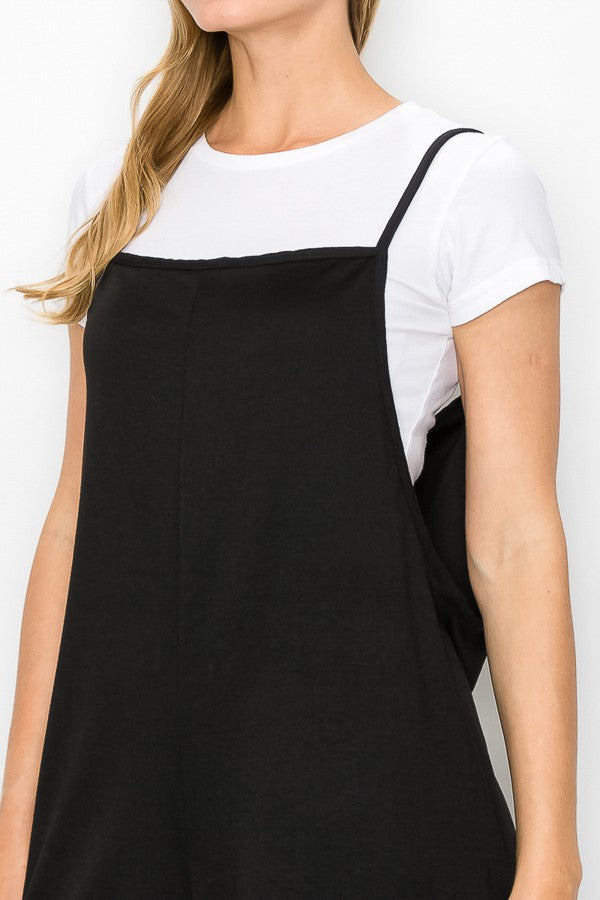 A stylish black cropped bottom wide leg oversized jumpsuit featuring spaghetti straps and a comfortable fit, perfect for casual and semi-formal occasions.