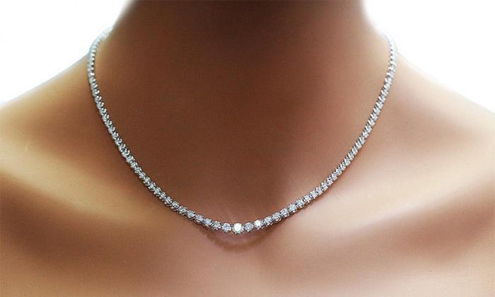 A stunning Cubic Zirconia Tennis Necklace featuring 42 carats of sparkling crystals set in 18K white gold plating.