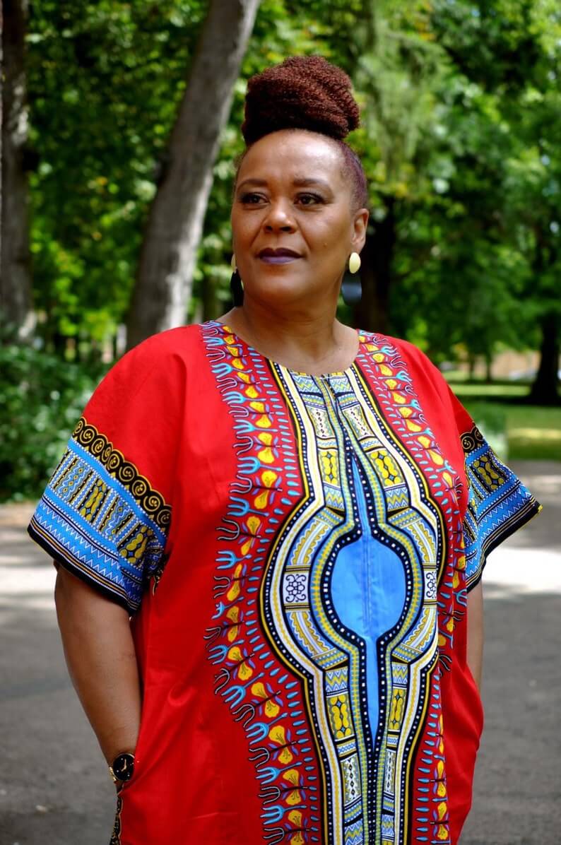 A vibrant red Dashiki kaftan maxi dress featuring traditional African prints on the front and back, made from lightweight cotton fabric.