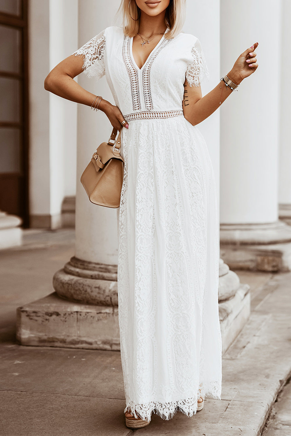 Elegant White Boho Lace Maxi Dress featuring a V-neckline and intricate lace cut-out details, perfect for summer occasions.