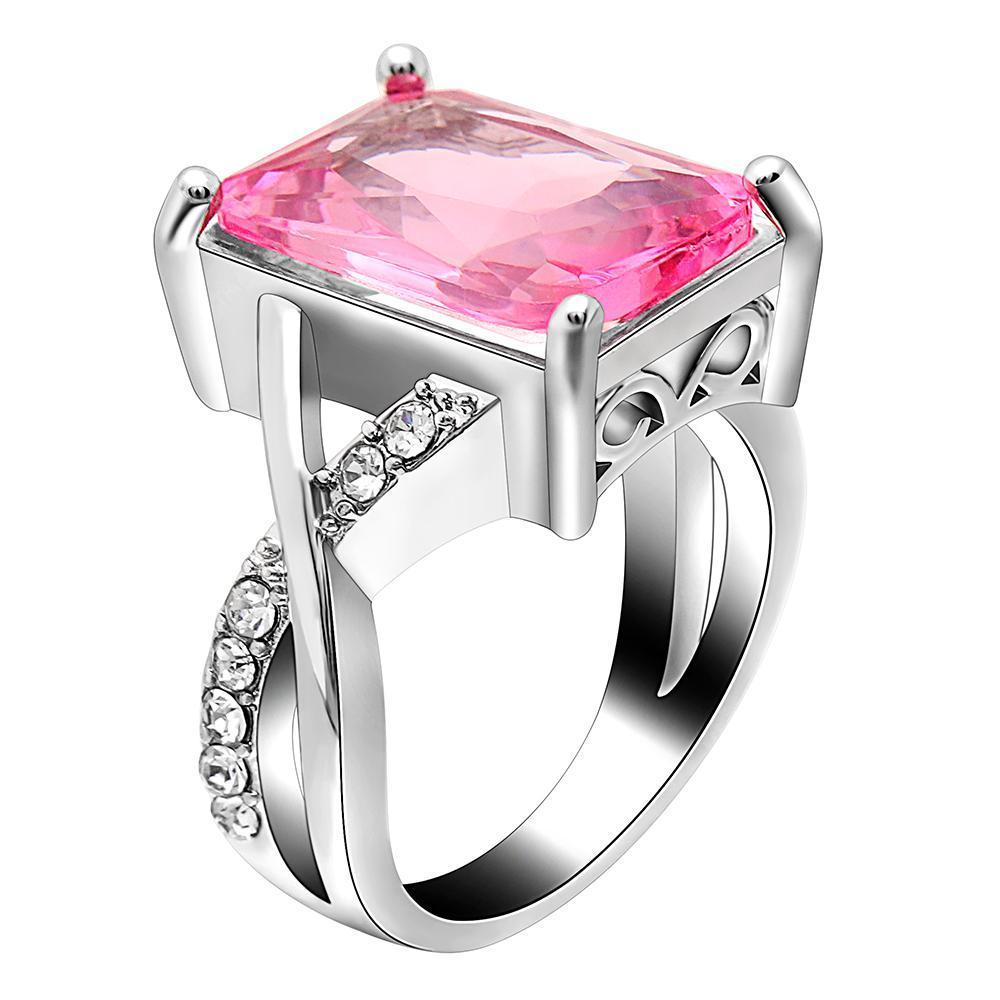 Emerald cut pink crystal swirl ring set made with Swarovski elements, featuring 18K white gold plating and a unique design.