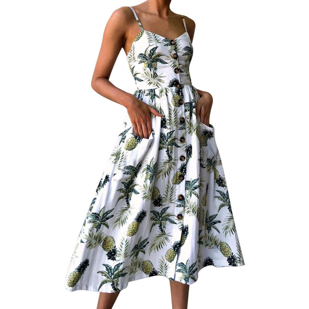 A vibrant Floral Shoulder Strap Summer Dress featuring a green floral pattern, perfect for summer outings.