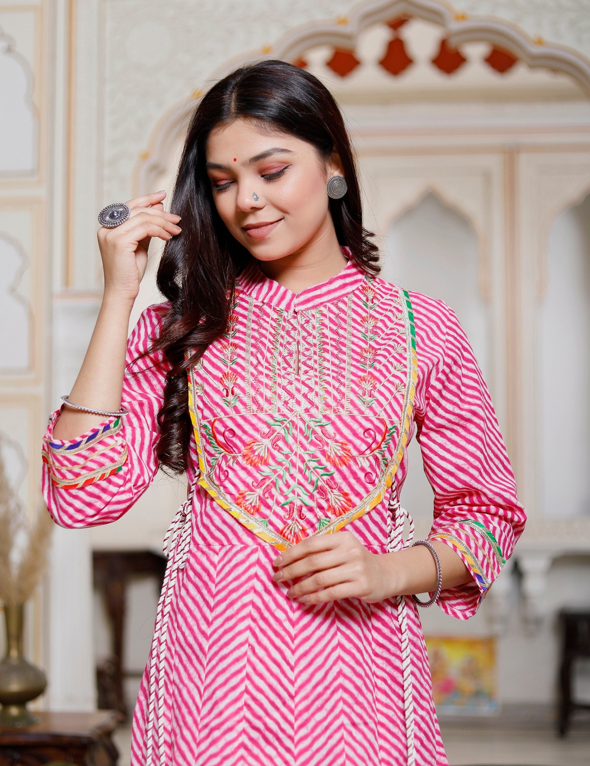 Elegant pink Indian Anarkali Kurti made of heavy cotton with intricate embroidery, perfect for weddings and festive occasions.