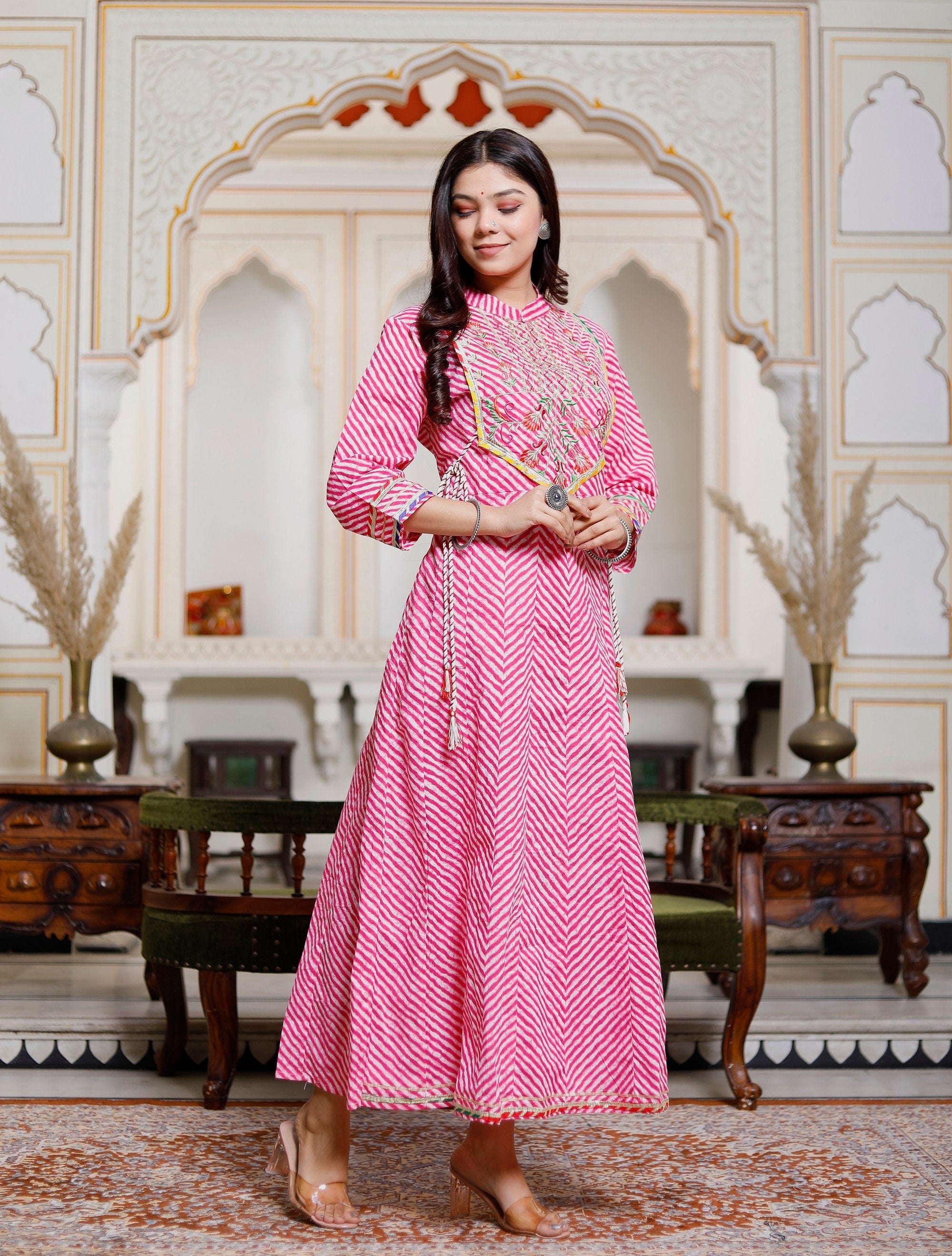 Elegant pink Indian Anarkali Kurti made of heavy cotton with intricate embroidery, perfect for weddings and festive occasions.