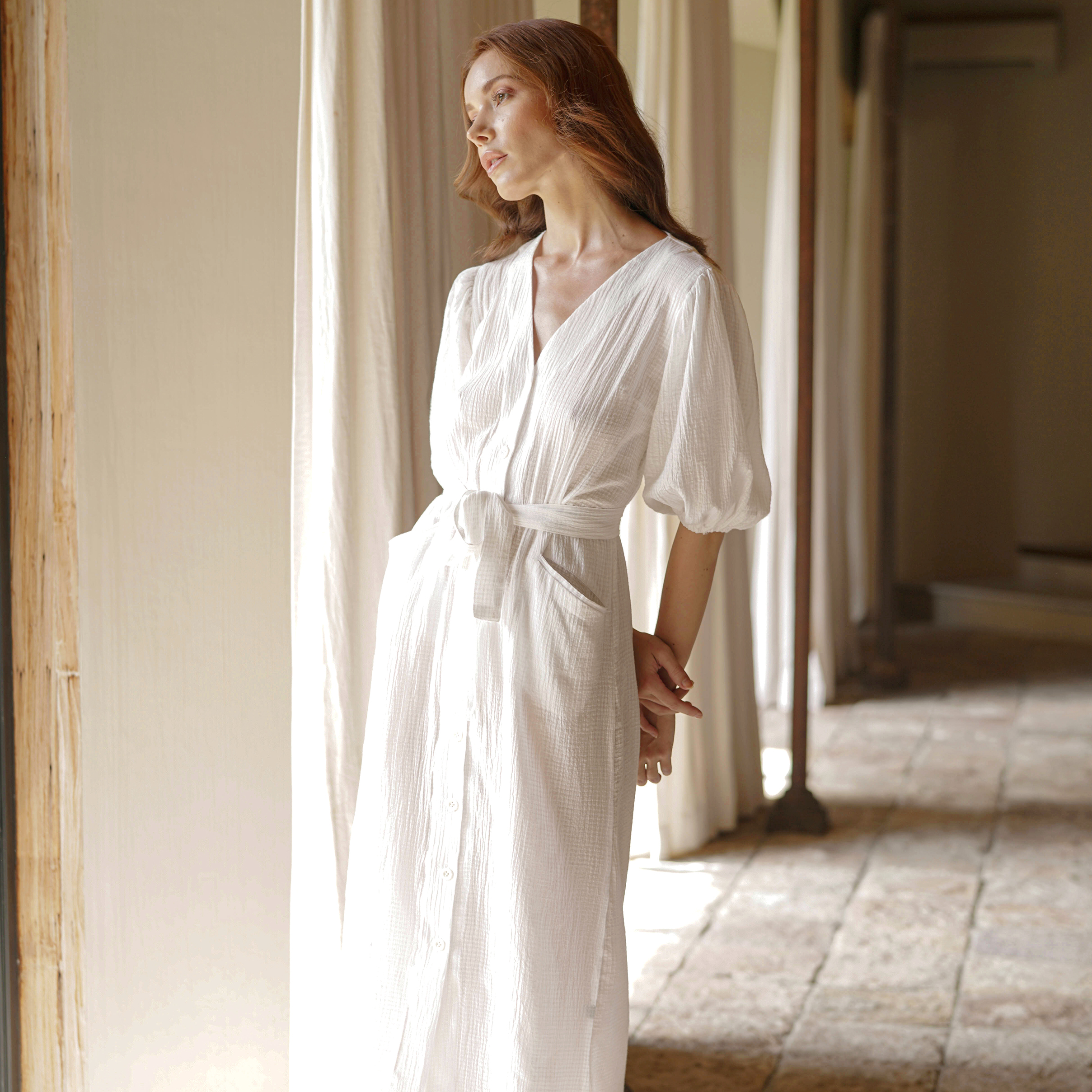 Meghan Crinkle Midi Dress in Off-White featuring V-neck, balloon sleeves, and removable knot belt, made from 100% cotton.
