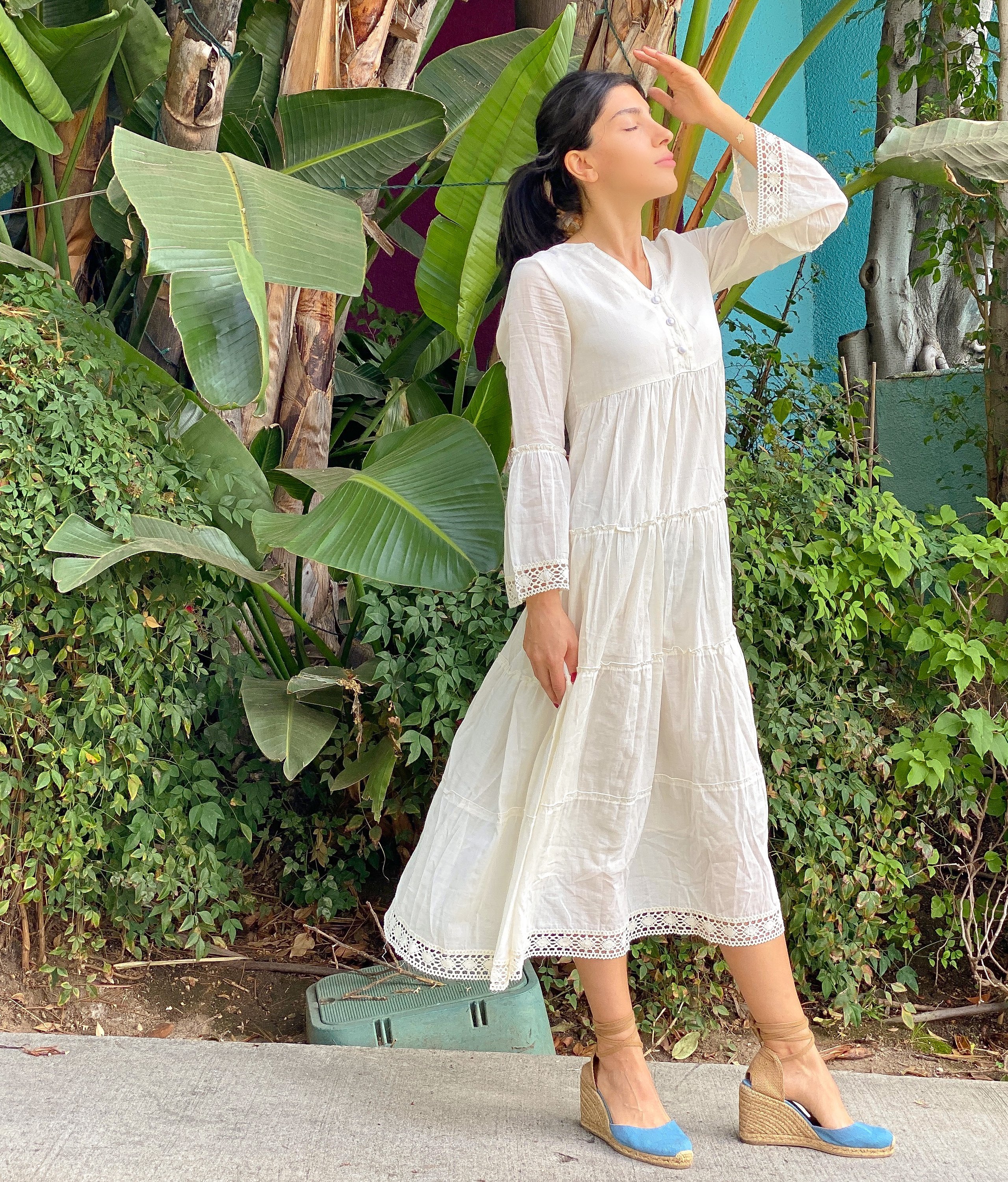MIKA MAXI DRESS in natural color featuring a V-neckline, tiered skirt, and lace edging, perfect for a breezy summer look.
