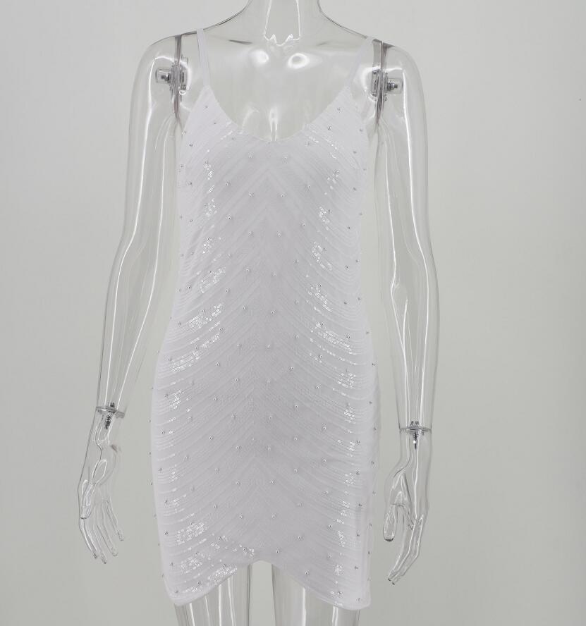 A glamorous sequin dress featuring a stretch sequin skirt, open back design, and beaded spaghetti straps, perfect for summer parties.