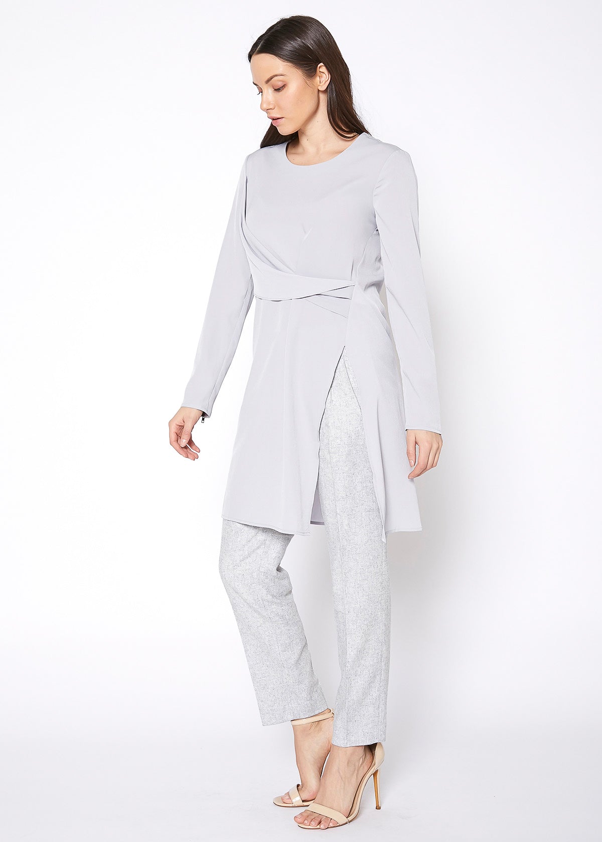 A stylish Slit Hem Twist Front Dress featuring a twist front detail, chic slit hem, and long sleeves with zipper cuffs.