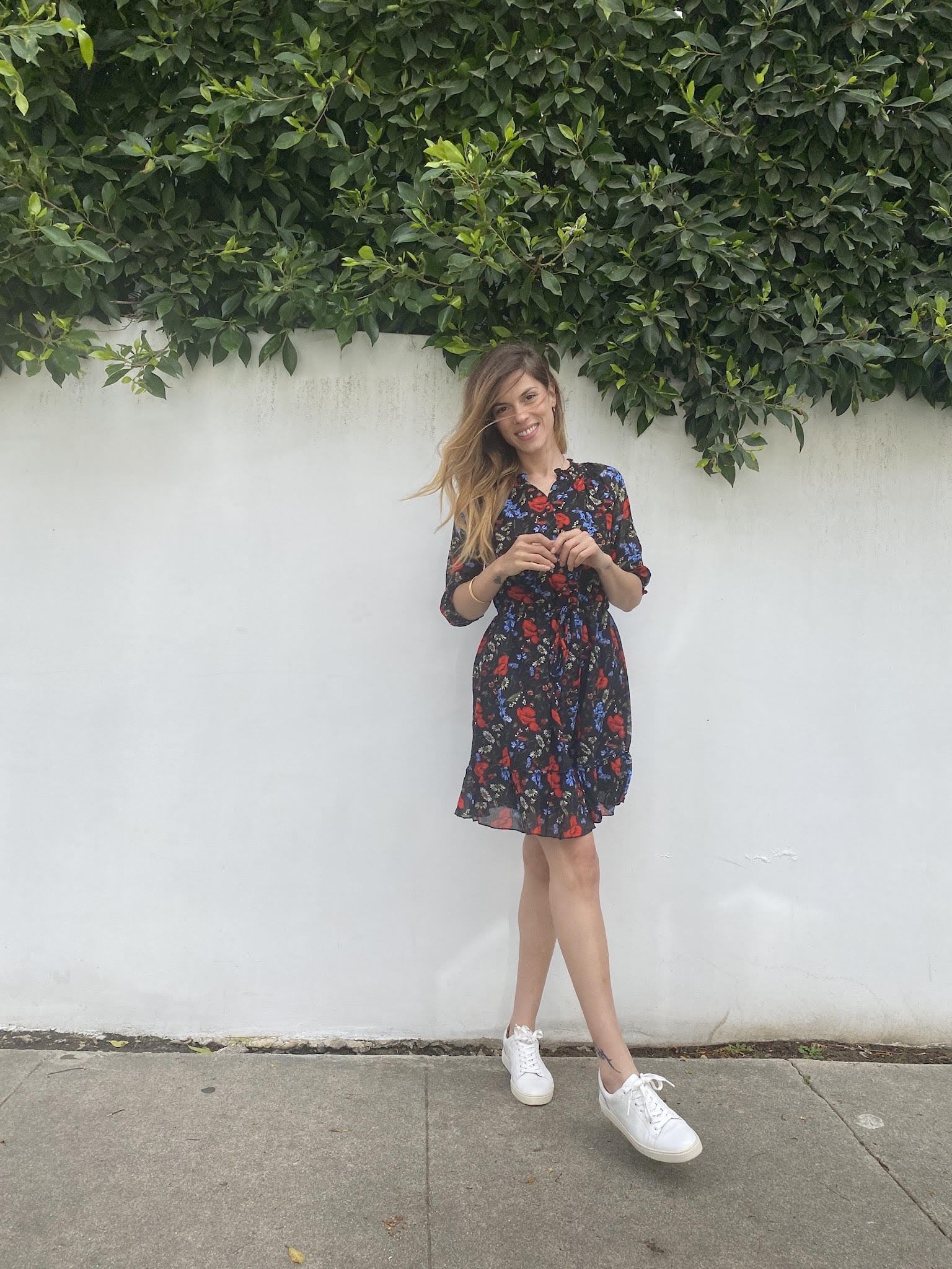 VIRGO Mini Dress in Poppy Black featuring floral prints and a V-neck design, made from 100% cotton.