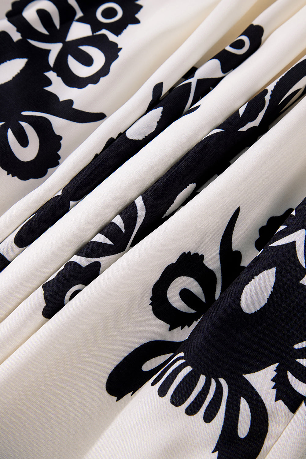 A vibrant Western Pattern Tasseled Notch Mini Dress featuring chic tassels and dynamic geometric patterns, perfect for stylish occasions.