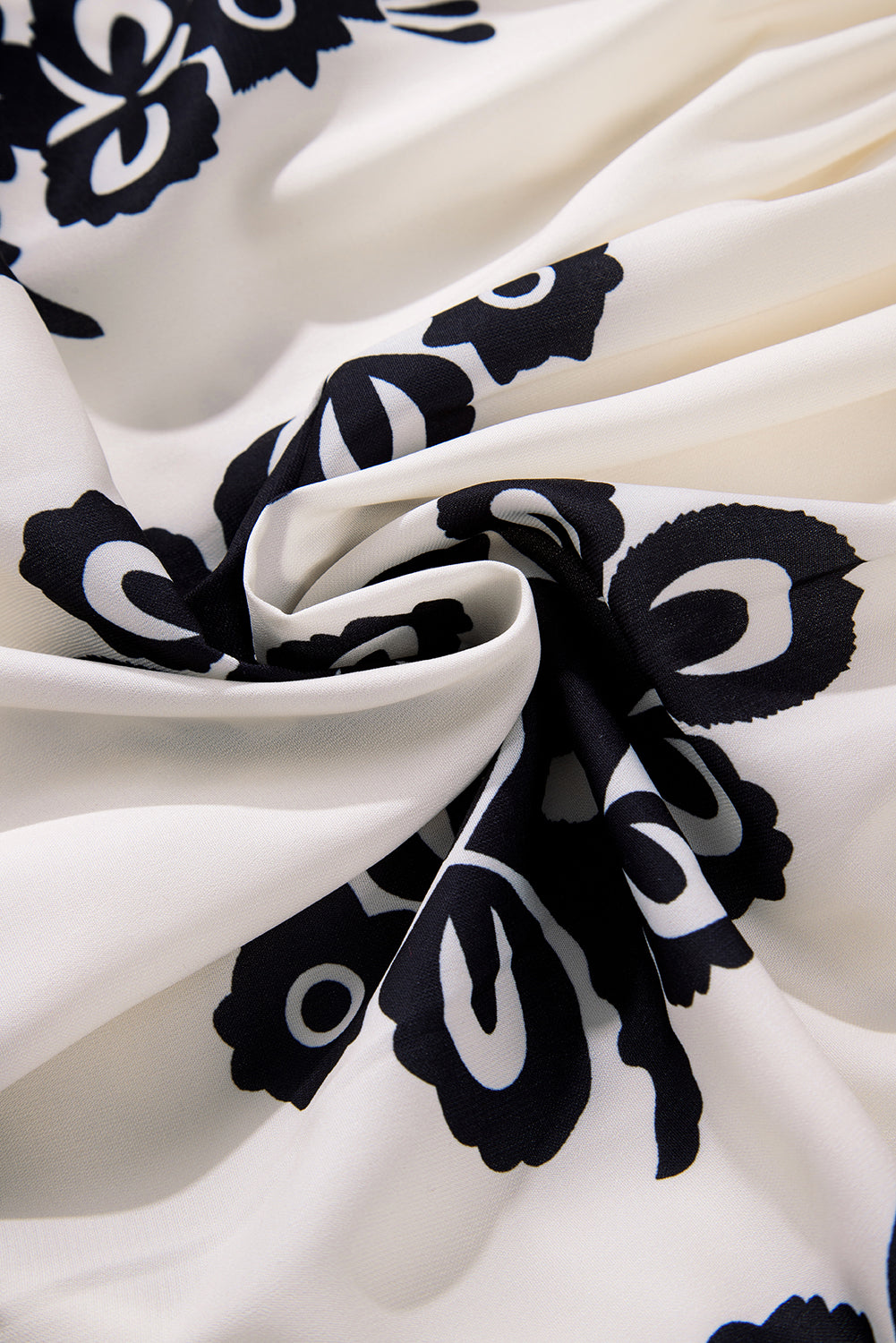 A vibrant Western Pattern Tasseled Notch Mini Dress featuring chic tassels and dynamic geometric patterns, perfect for stylish occasions.