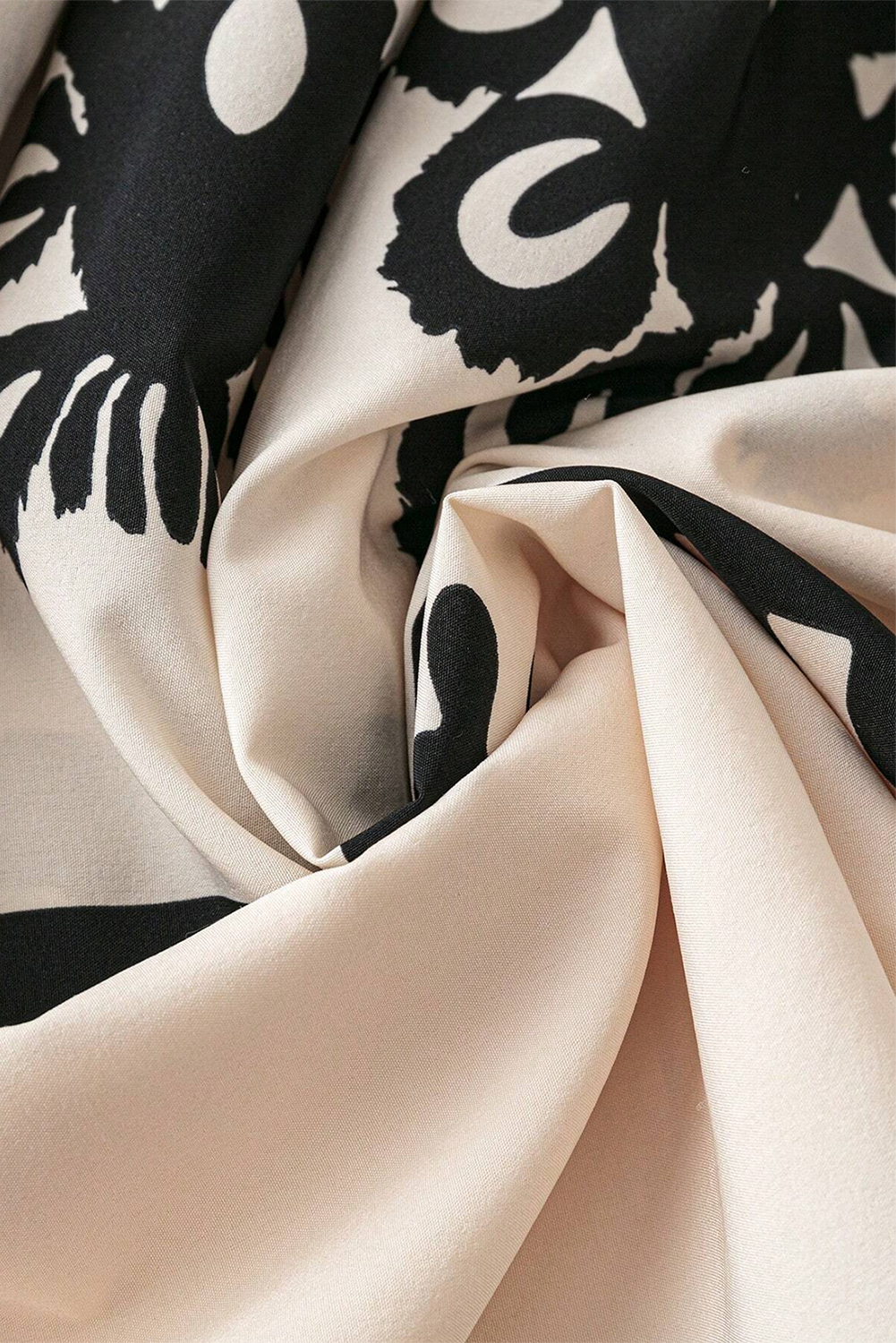 A vibrant Western Pattern Tasseled Notch Mini Dress featuring chic tassels and dynamic geometric patterns, perfect for stylish occasions.