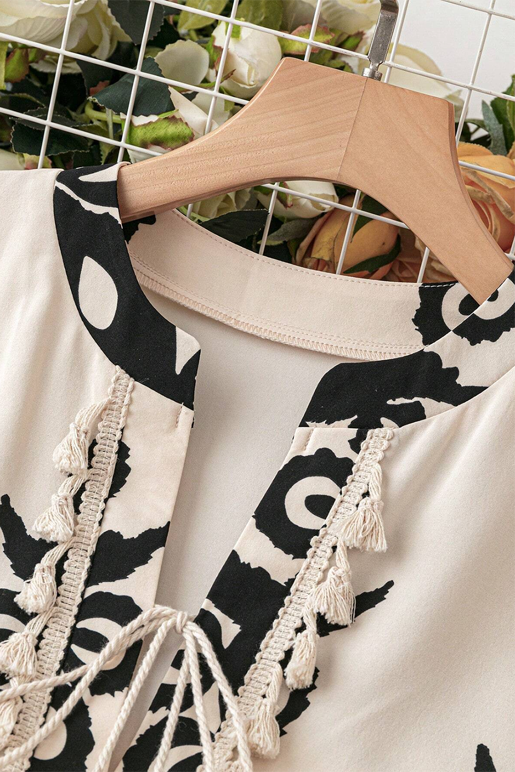 A vibrant Western Pattern Tasseled Notch Mini Dress featuring chic tassels and dynamic geometric patterns, perfect for stylish occasions.