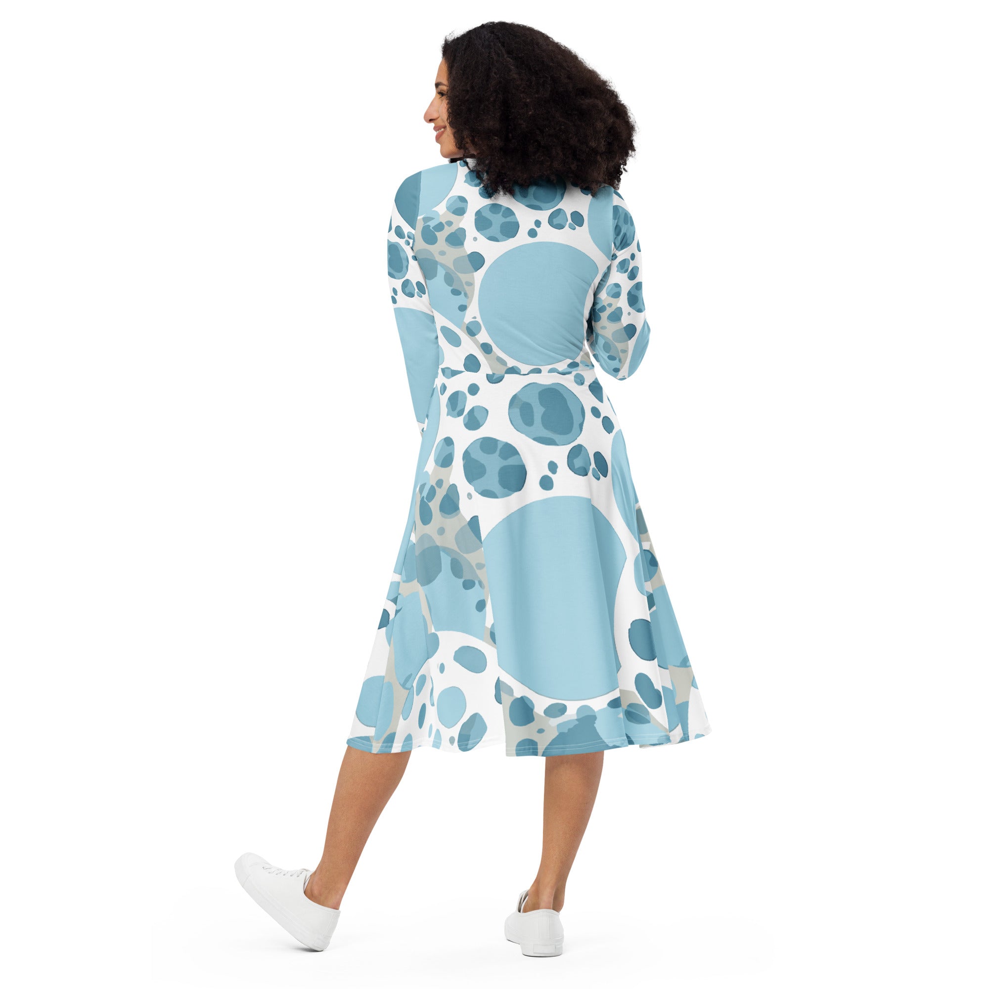 Womens Long Sleeve Midi Dress in blue and white circular spotted design, showcasing its elegant silhouette and side pockets.