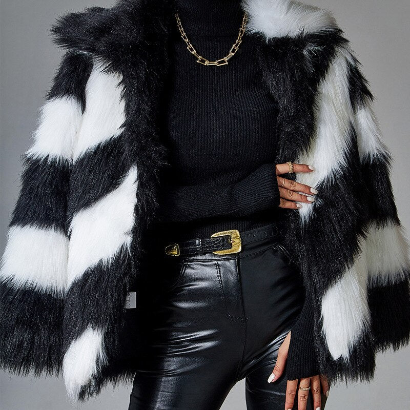 A luxurious black faux rabbit fur coat with a turn-down collar and plush fox fur trim, perfect for stylish women.