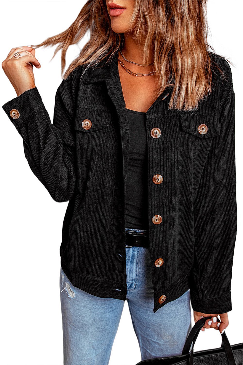 Black ribbed corduroy jacket with full sleeves and turn-down collar, featuring button closure and front pockets.