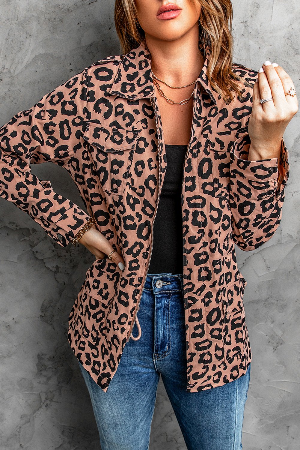 Brown leopard print coat with zipper closure and drawstring waist, featuring long sleeves and a lapel collar.