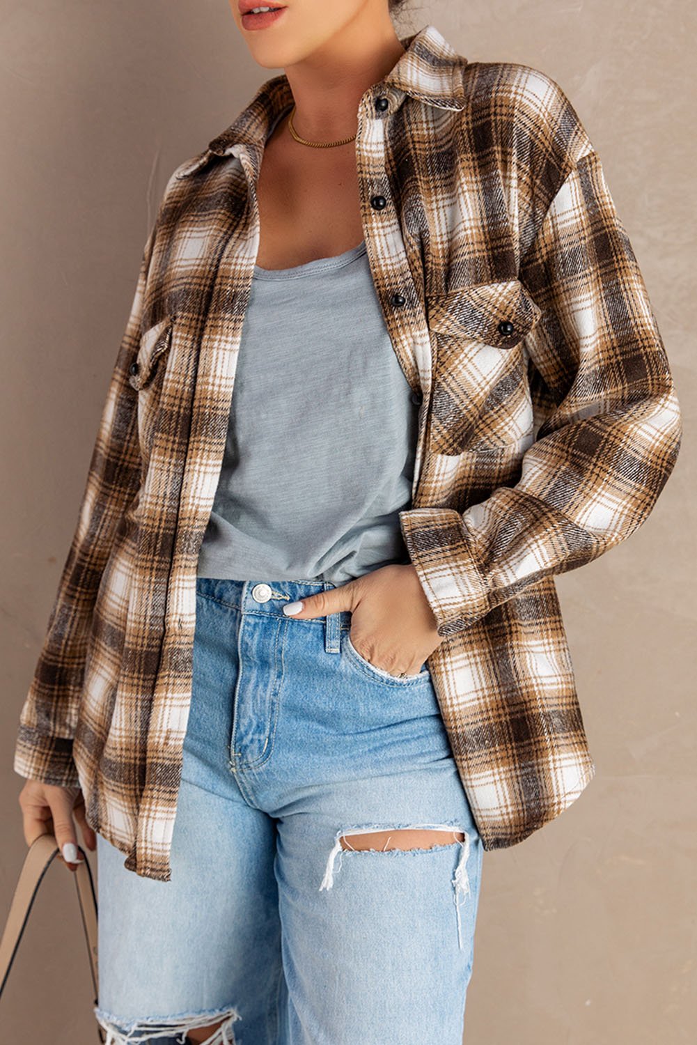 Buttons Pocketed Plaid Shacket featuring a turn-down collar, long sleeves, and front pockets in a classic plaid pattern.