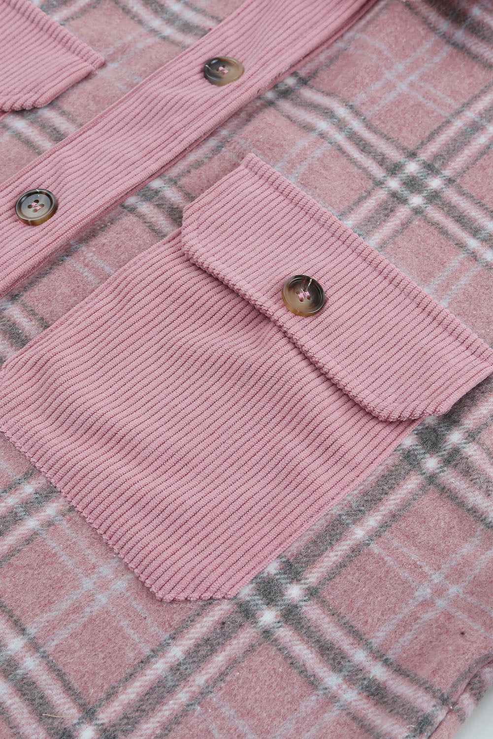 Corduroy plaid pattern shacket featuring a relaxed fit, chest pockets, and button closure, perfect for casual wear.