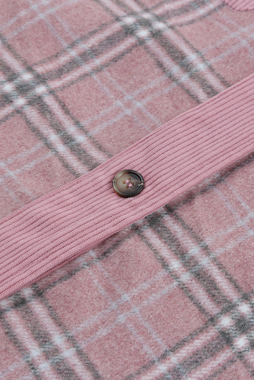 Corduroy plaid pattern shacket featuring a relaxed fit, chest pockets, and button closure, perfect for casual wear.