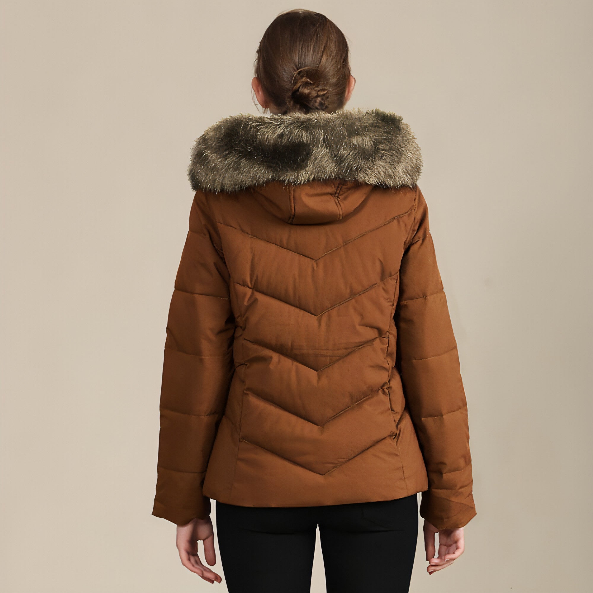 A stylish women's cotton-padded jacket with a standing collar, perfect for cold weather, showcasing its elegant design and warm features.