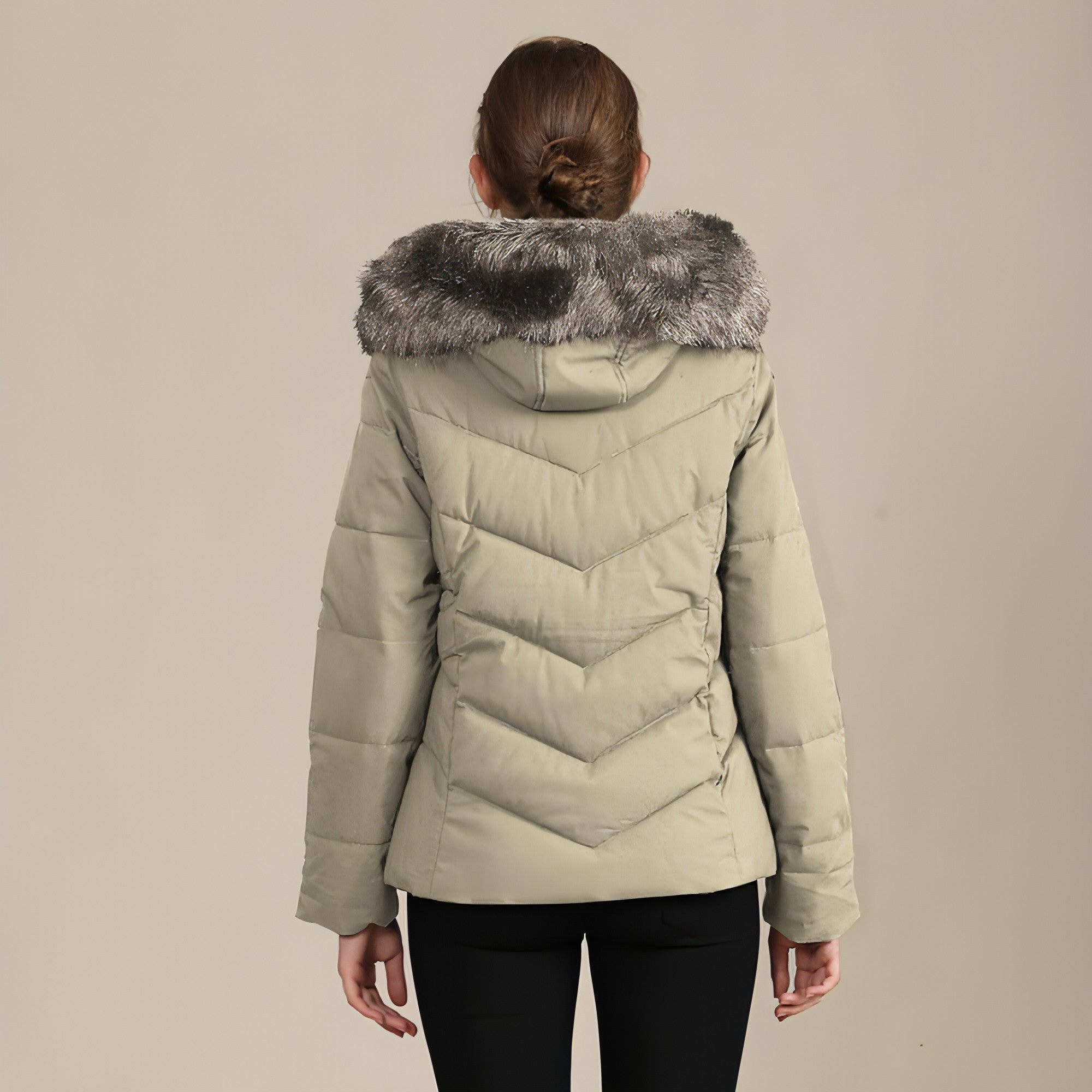 A stylish women's cotton-padded jacket with a standing collar, perfect for cold weather, showcasing its elegant design and warm features.