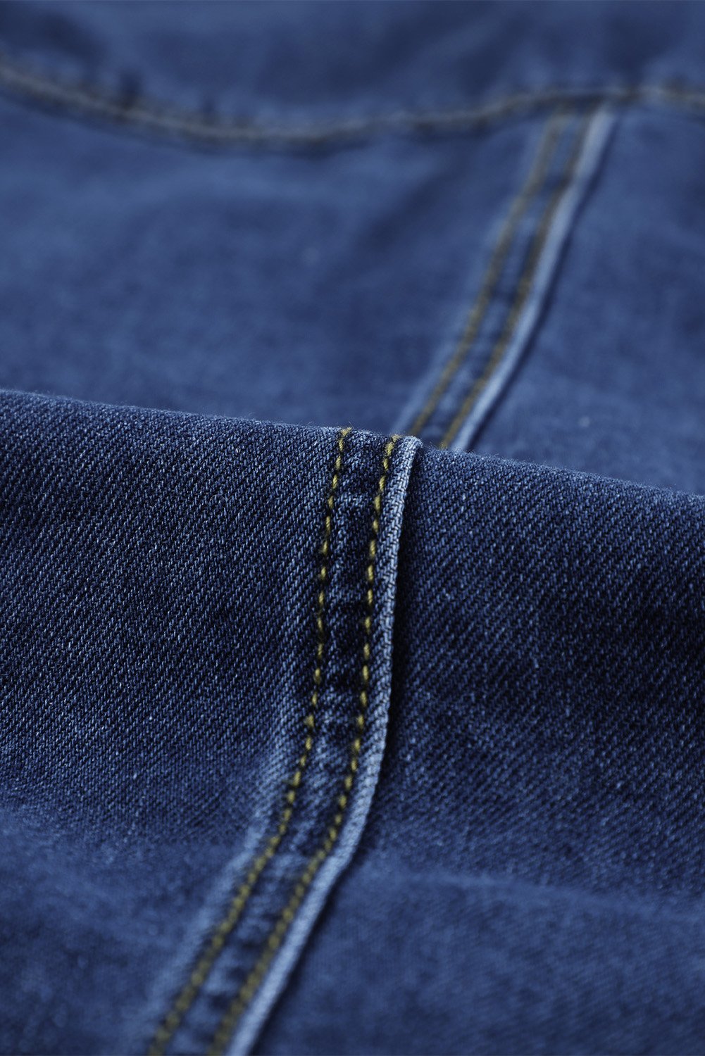 Dark blue jeans shacket with elegant collar and distressed design, featuring button closure and pockets.