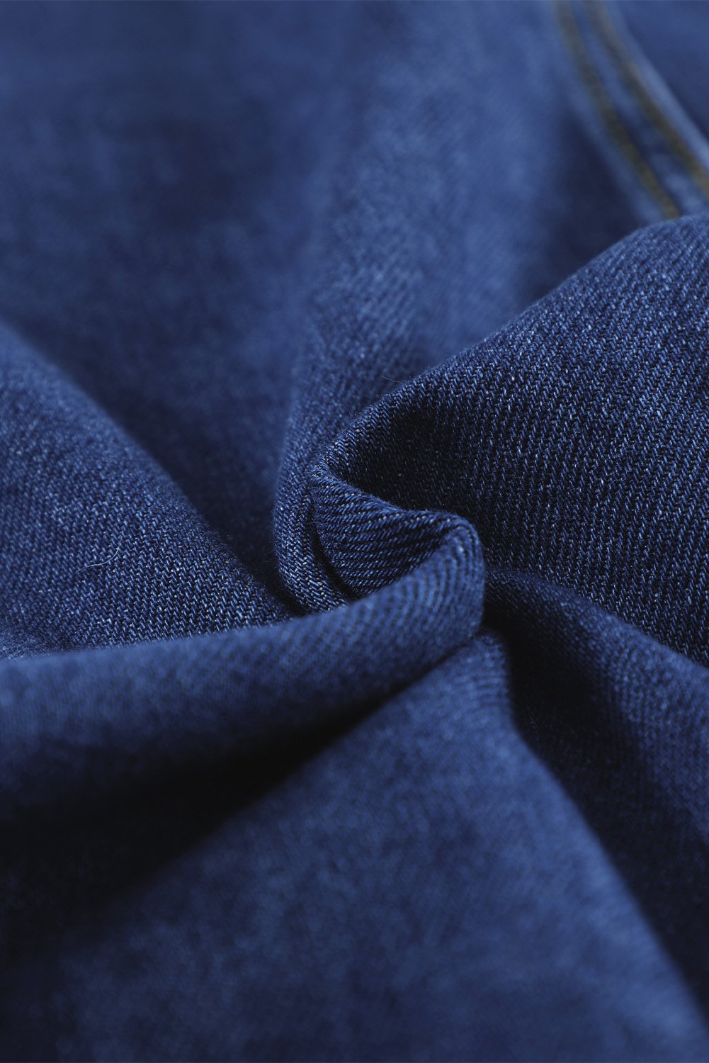 Dark blue jeans shacket with elegant collar and distressed design, featuring button closure and pockets.