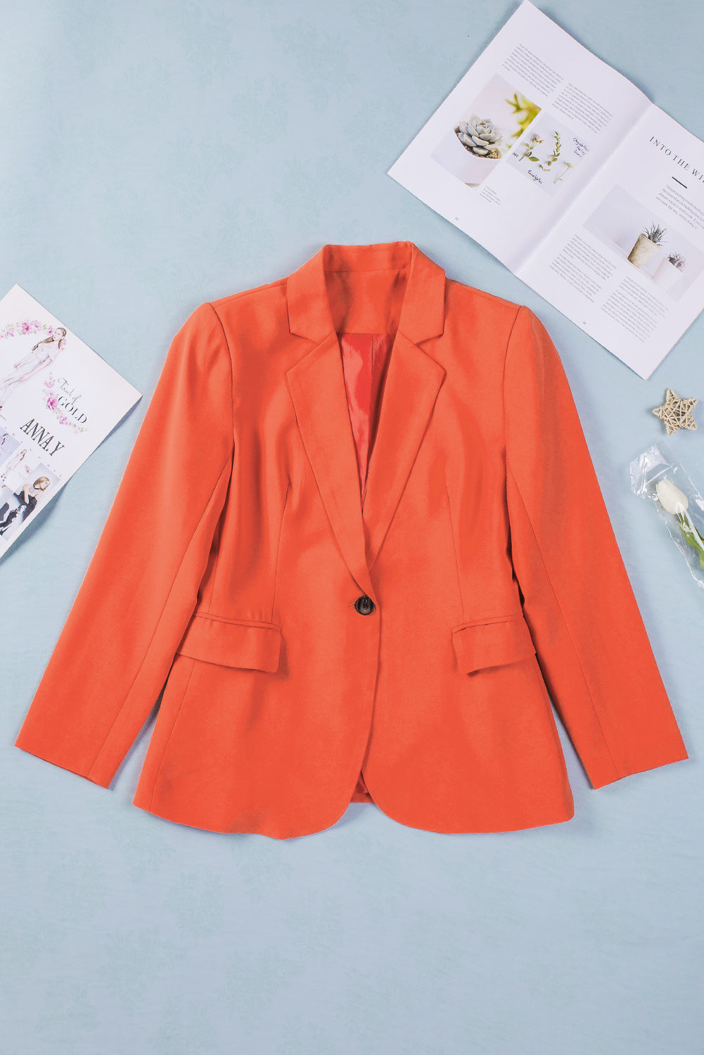 A stylish women's blazer coat featuring a flip pocket design, single-button closure, and notched neckline, perfect for office and casual wear.