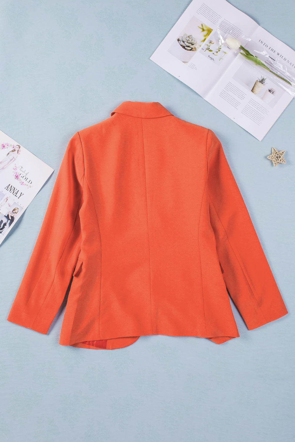 A stylish women's blazer coat featuring a flip pocket design, single-button closure, and notched neckline, perfect for office and casual wear.
