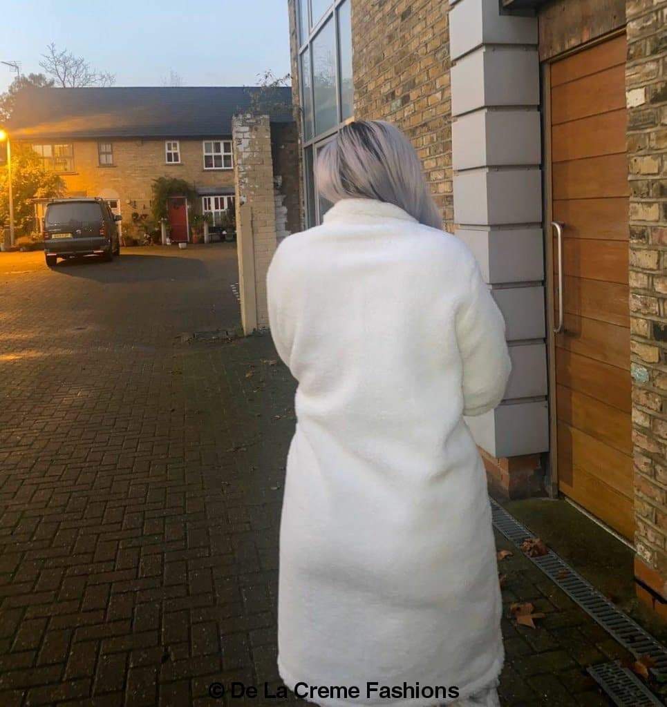 Jackie Double Breasted Borg Teddy Midi Coat in a stylish oversized design with a soft teddy finish, featuring double breasted buttons and side pockets.