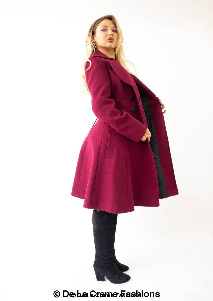 Kirsty Slim Fit A-Line Coat in Black, showcasing double breasted fastening and roll collared V-neckline.