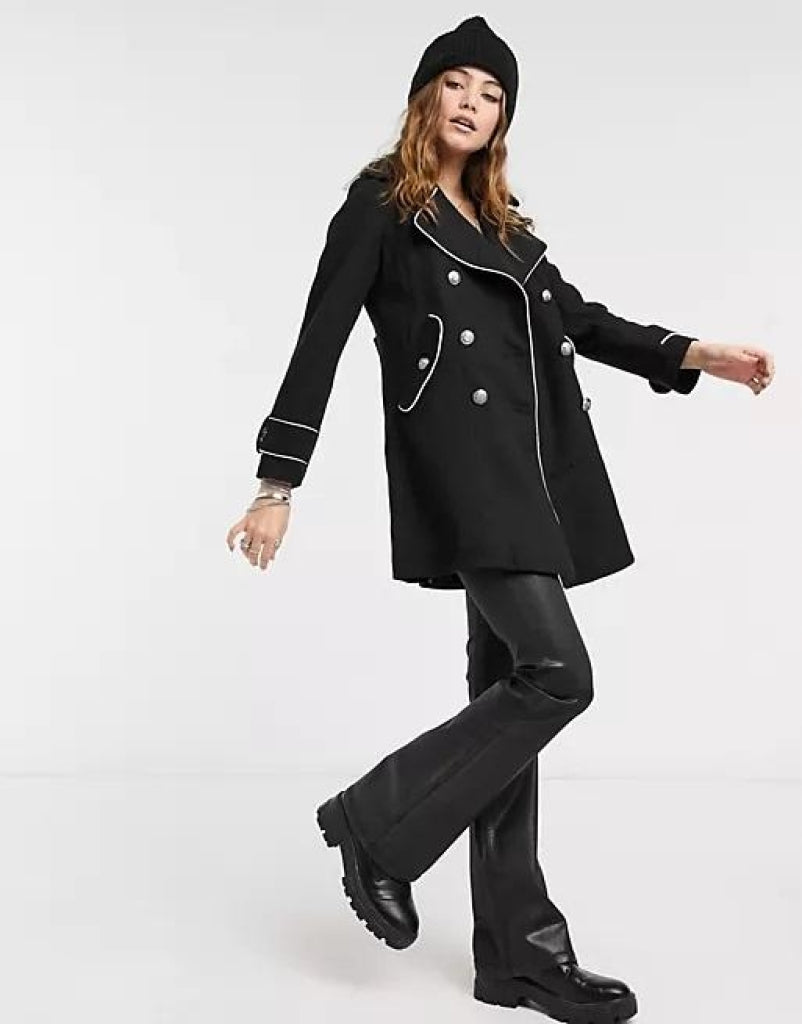 A stylish women's military coat featuring contrast metal buttons and a double-breasted design, made from luxurious twill fabric.