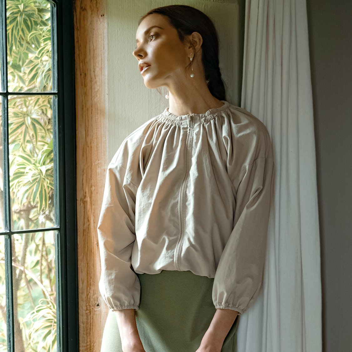 NORMA Recycled Ruffle Jacket in Beige, showcasing its stylish design and eco-friendly fabric made from recycled plastic bottles.