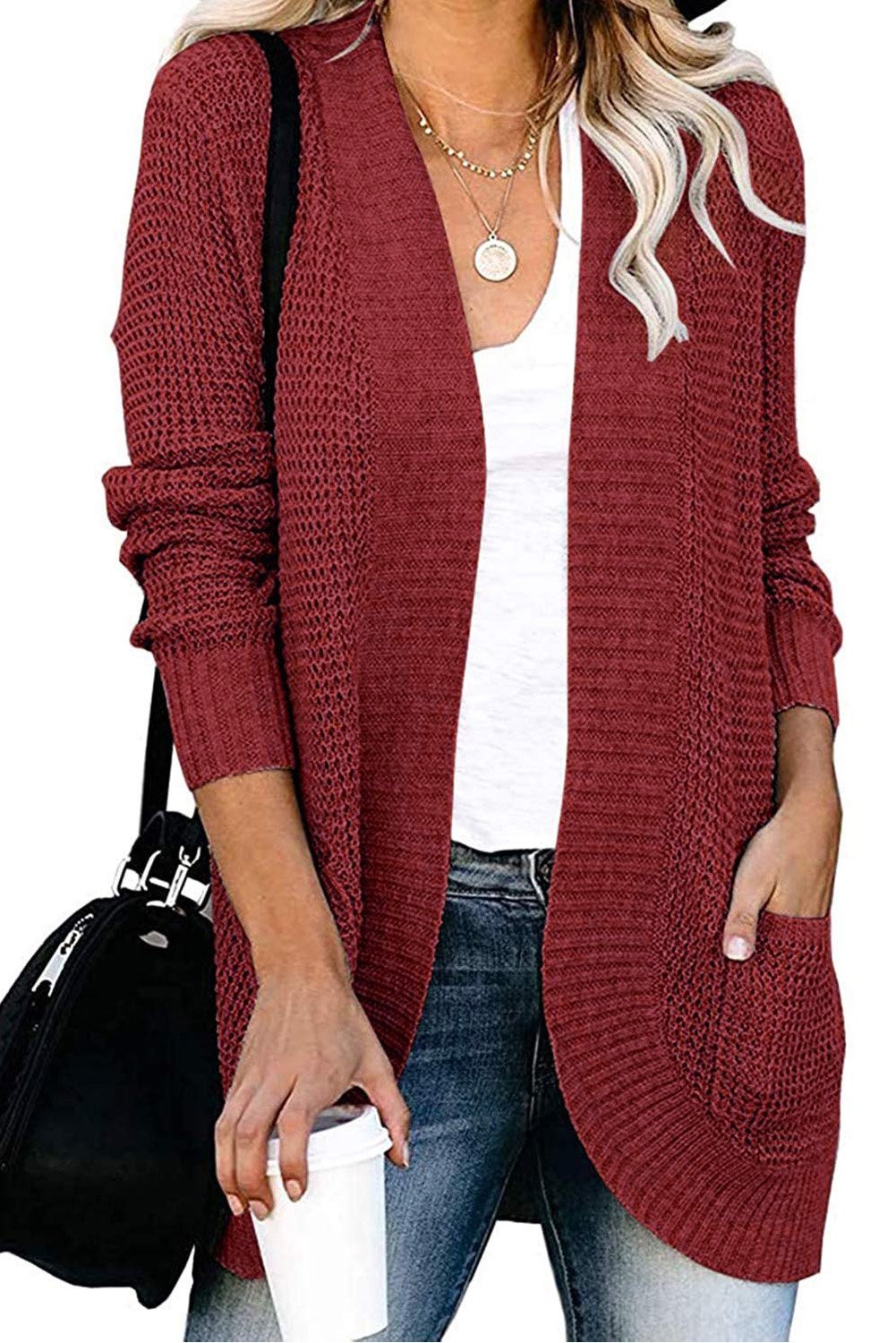 A stylish Pocket Knitted Solid Color Cardigan featuring a fuzzy texture and arc-shaped hem, perfect for layering over casual outfits.