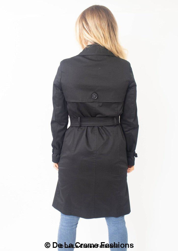 A stylish Slim Fit Lightweight Trench Coat in black, featuring double-breasted fastening and two side pockets, perfect for layering.