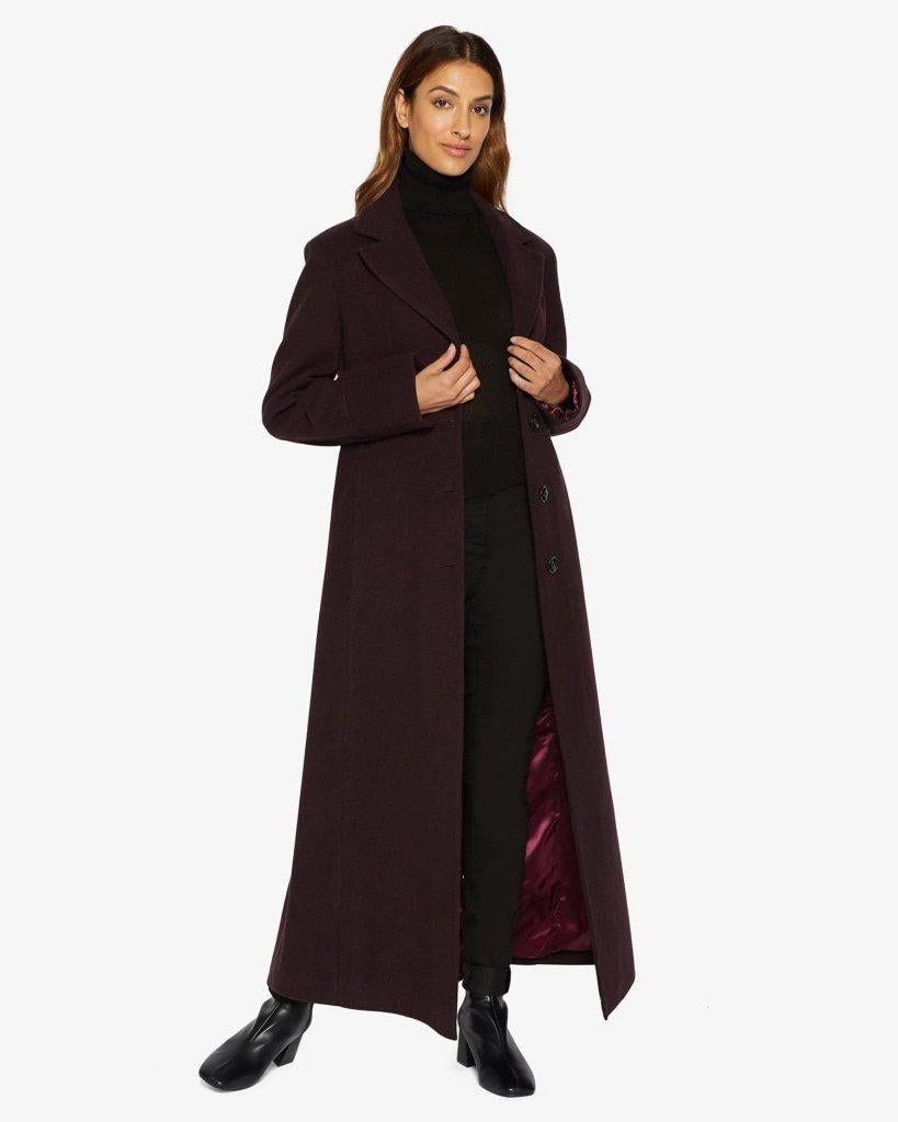 Slim Fit Wool Blend Longline Maxi Coat with collared design and side pockets, showcasing its elegant silhouette.