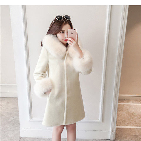 A stylish women's winter coat made of faux fur, featuring a hood and mid-length design, perfect for cold weather.