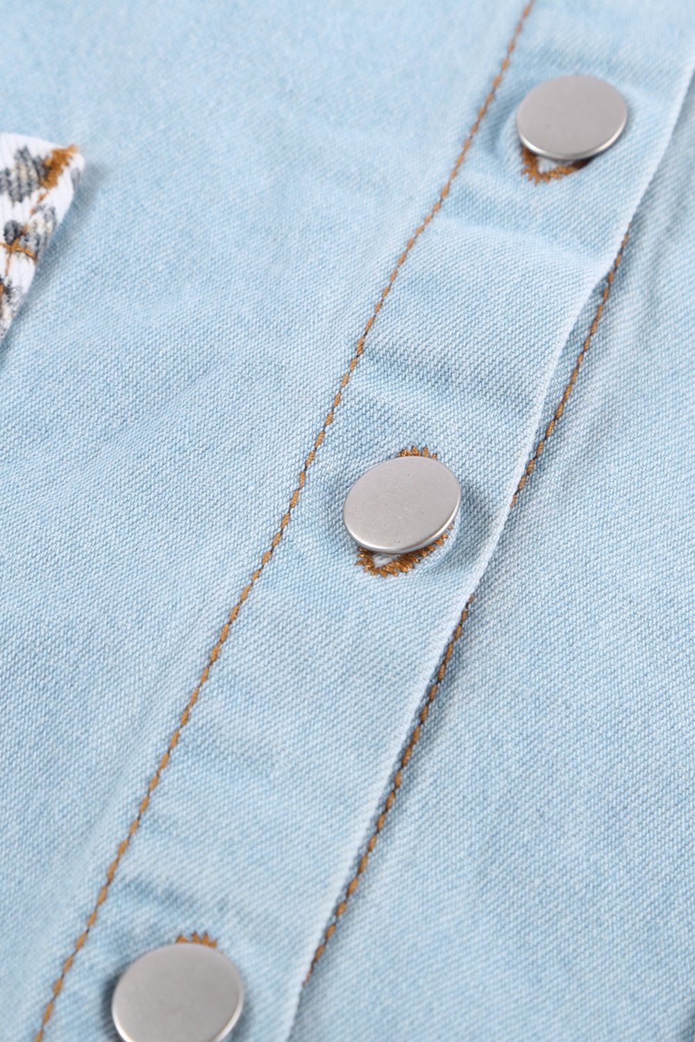 Women's Sky Blue Contrast Leopard Denim Jacket featuring leopard print sleeves and front snap closures, perfect for casual winter wear.