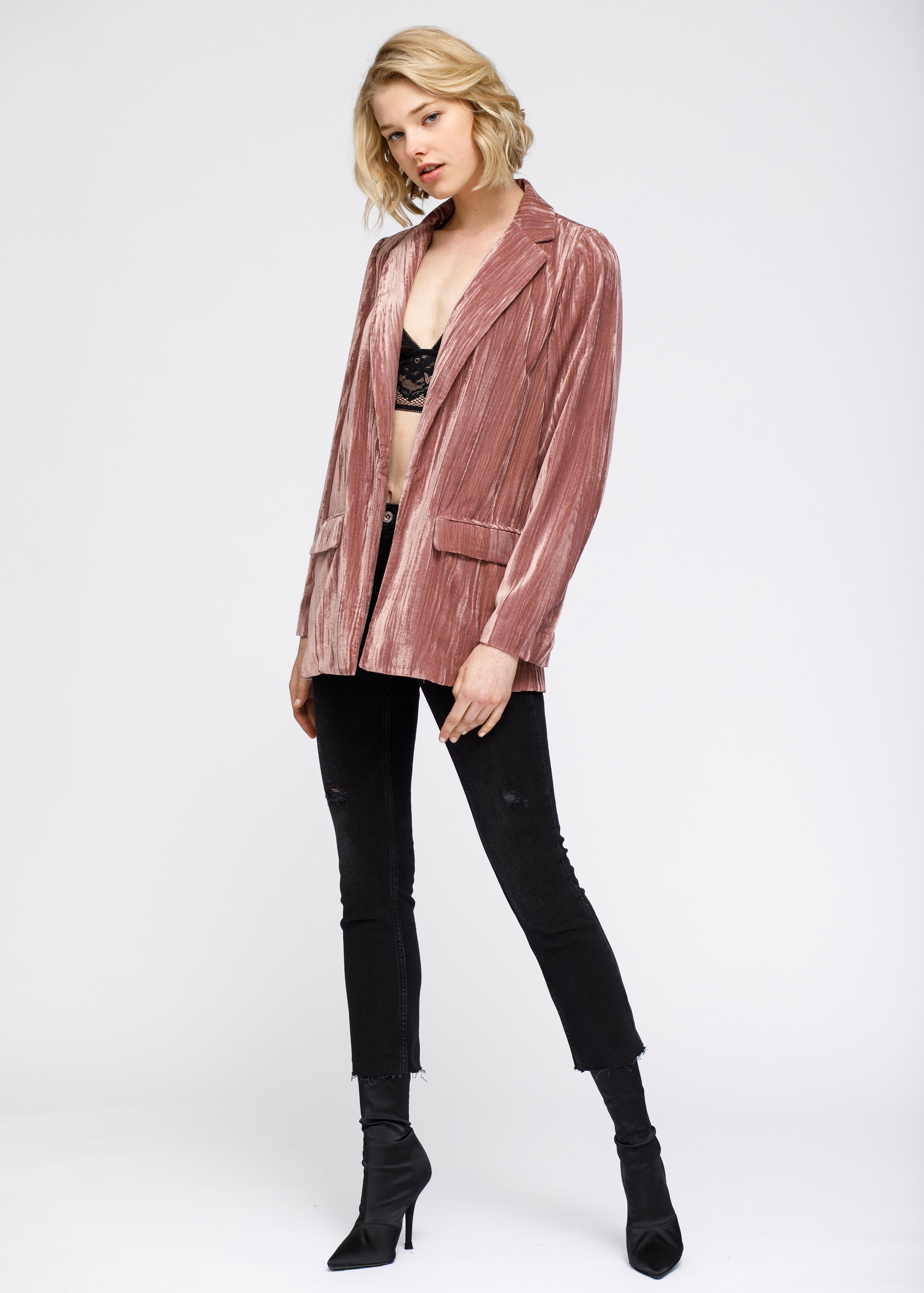 Women's velvet blazer in rogue color with flap pockets and notched collar, showcasing a luxurious crushed velvet texture.