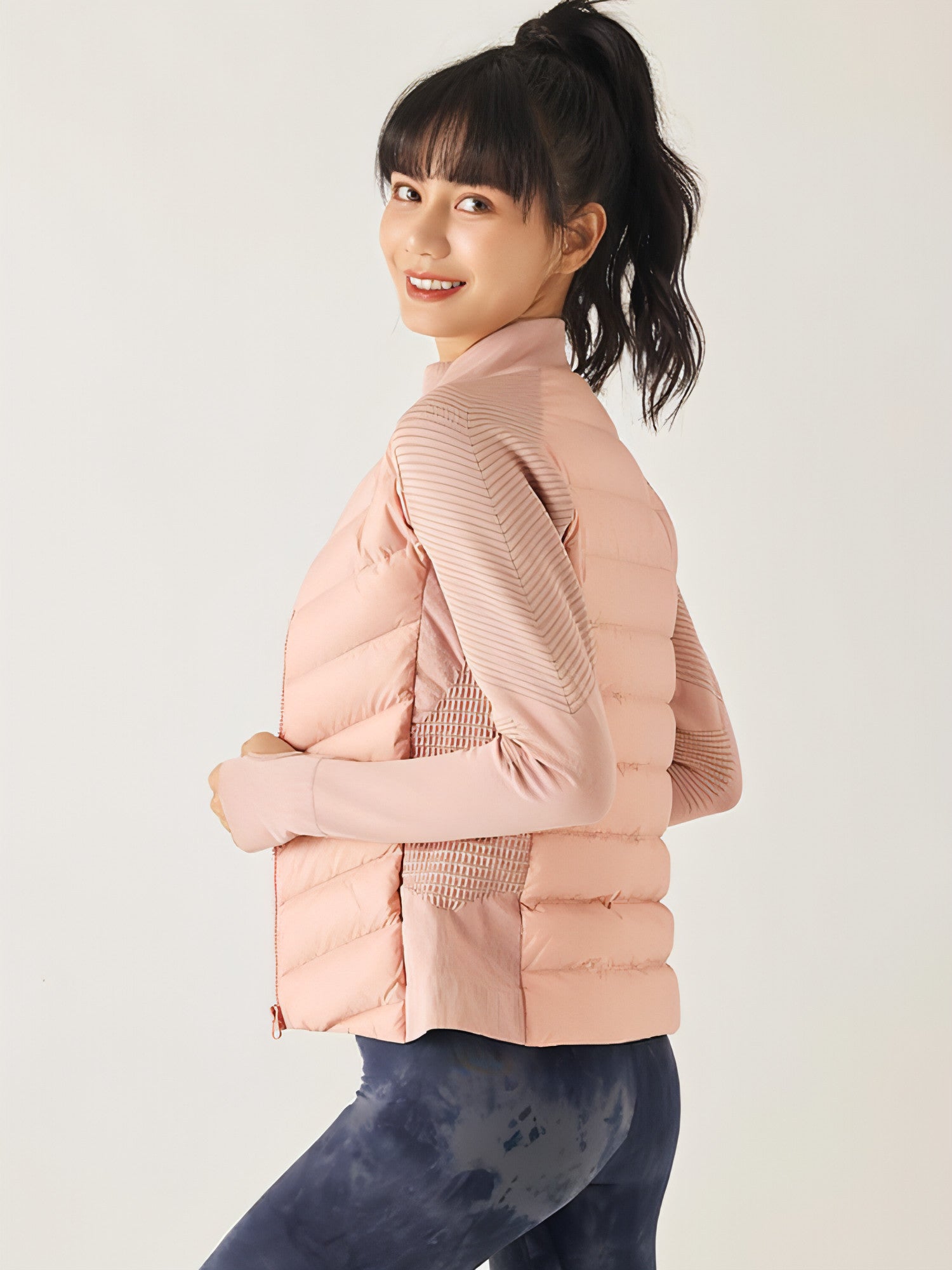 A stylish Yoga Sports Down Jacket for Women, featuring a lightweight design, adjustable hood, and multiple pockets, perfect for outdoor activities.