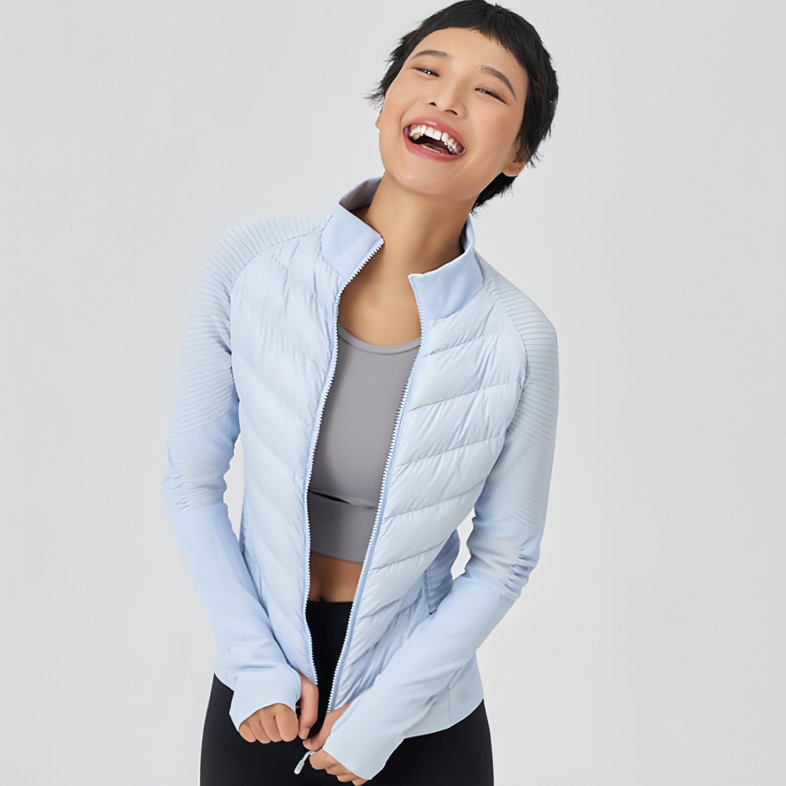 A stylish Yoga Sports Down Jacket for Women, featuring a lightweight design, adjustable hood, and multiple pockets, perfect for outdoor activities.